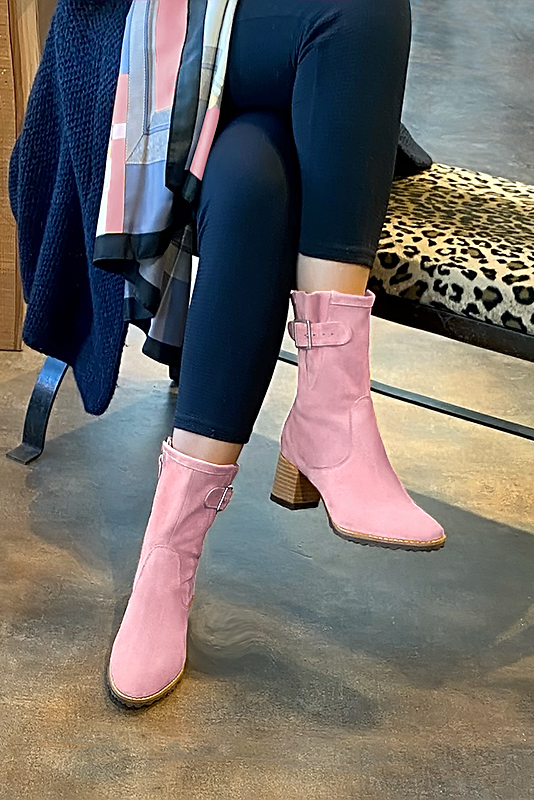 Carnation pink women's ankle boots with buckles on the sides. Round toe. Medium block heels. Worn view - Florence KOOIJMAN